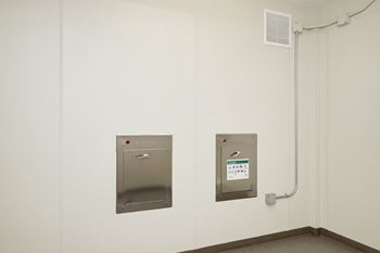 Trash and recycle chutes on each floor